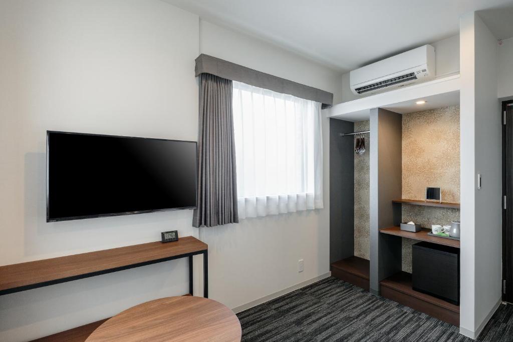TV a/nebo společenská místnost v ubytování M's Hotel Nijojo Oike