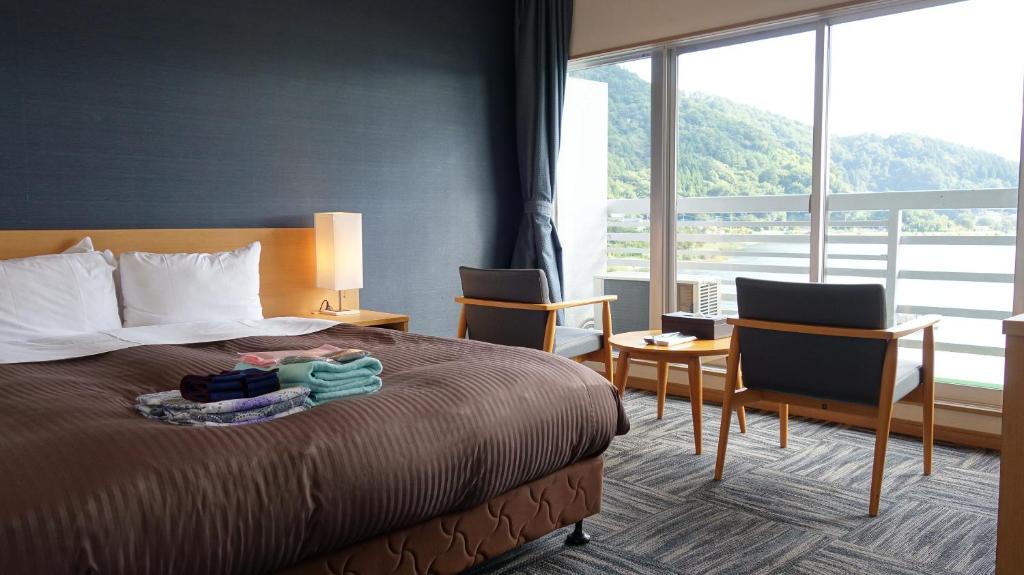 Postel nebo postele na pokoji v ubytování Hotel New Century