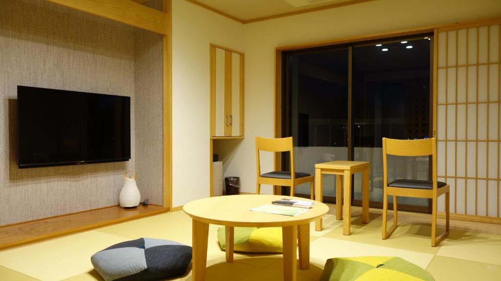 TV a/nebo společenská místnost v ubytování Hotel New Century