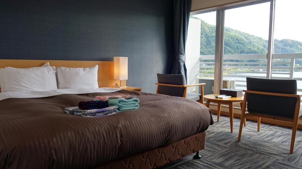 Postel nebo postele na pokoji v ubytování Hotel New Century
