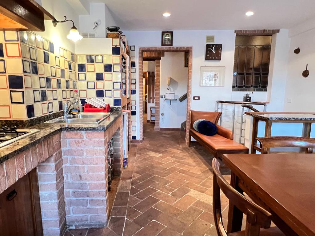 a kitchen with a sink and a counter top at Duprè Apartment in Siena