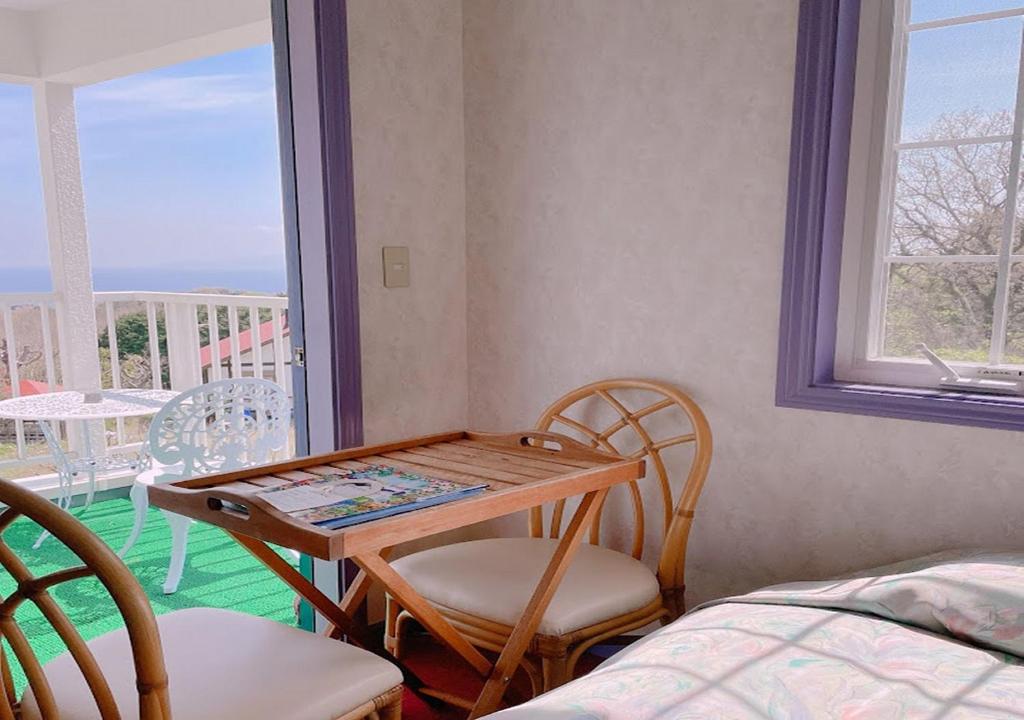 Postel nebo postele na pokoji v ubytování Tenshino Iruka