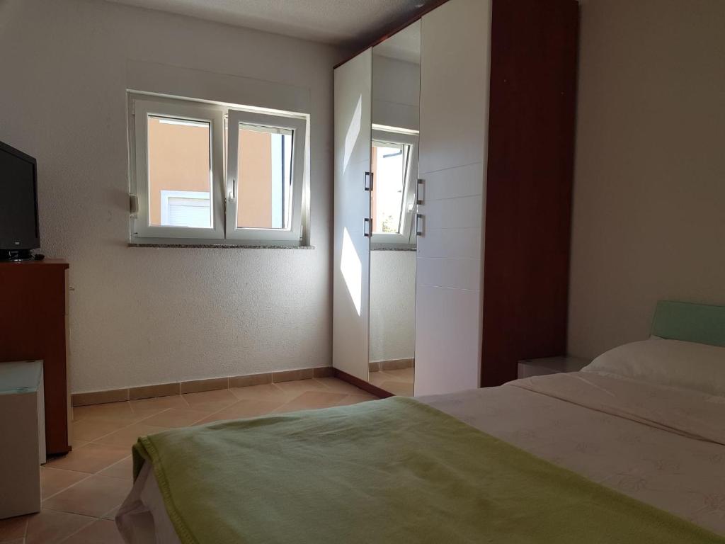 Postel nebo postele na pokoji v ubytování Minihaus in Zagreb