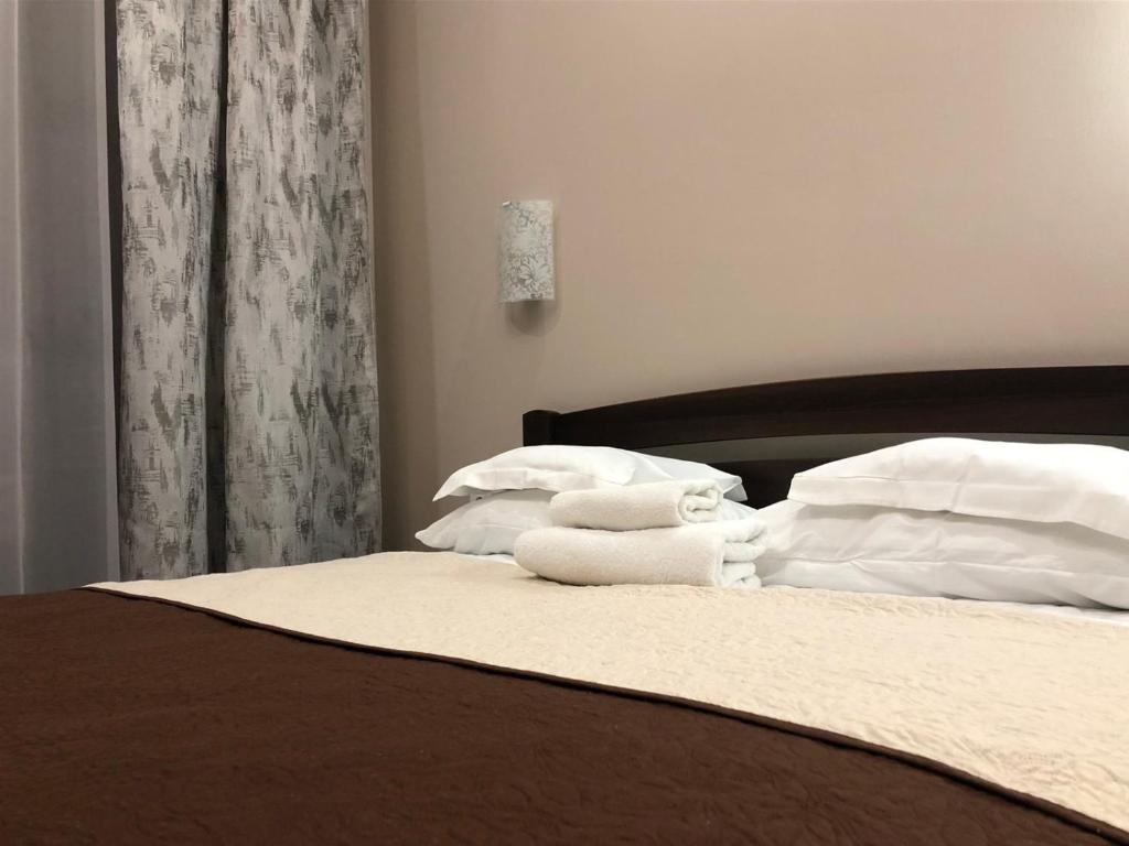 Postel nebo postele na pokoji v ubytování Atlant Hotel