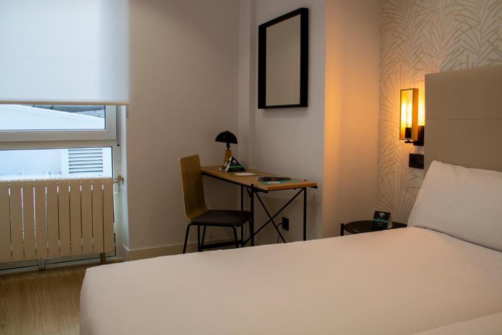 Postel nebo postele na pokoji v ubytování Hotel Alda Orzán