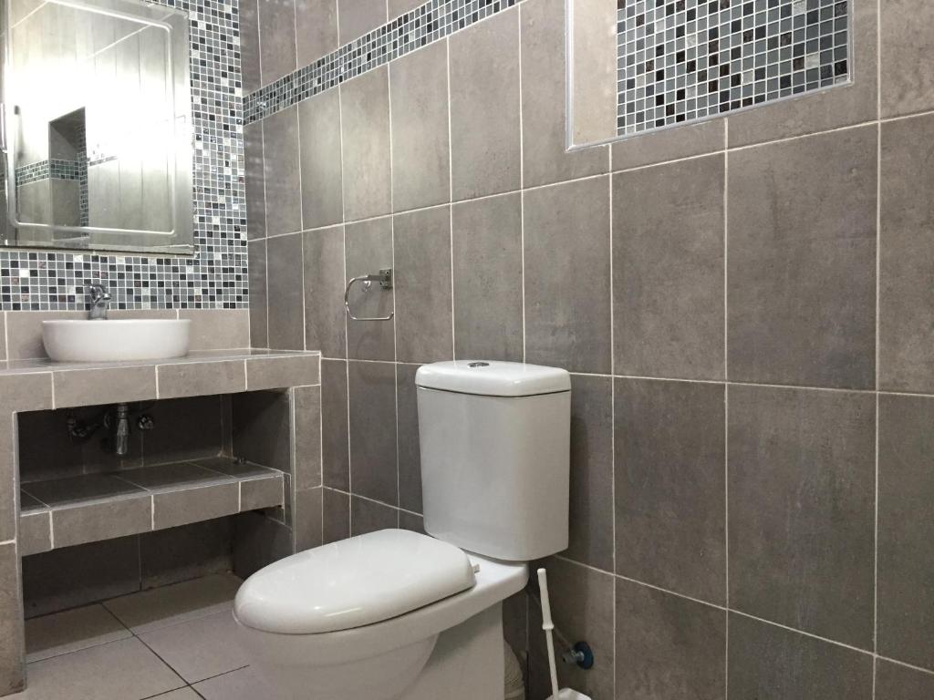 Koupelna v ubytování MASKANI Villa