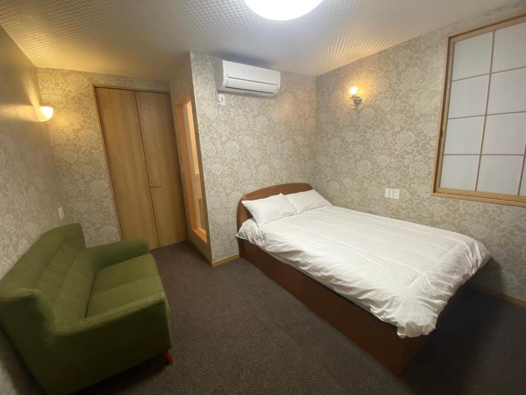 Postel nebo postele na pokoji v ubytování Allcomein Hotel Akihabara