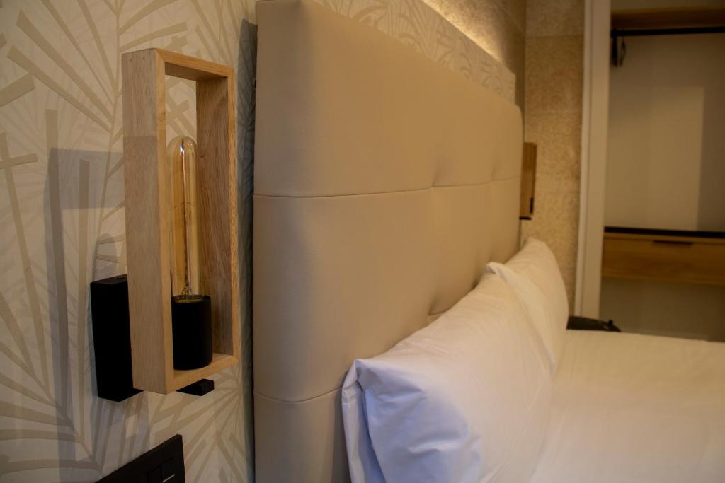 Postel nebo postele na pokoji v ubytování Hotel Alda Orzán