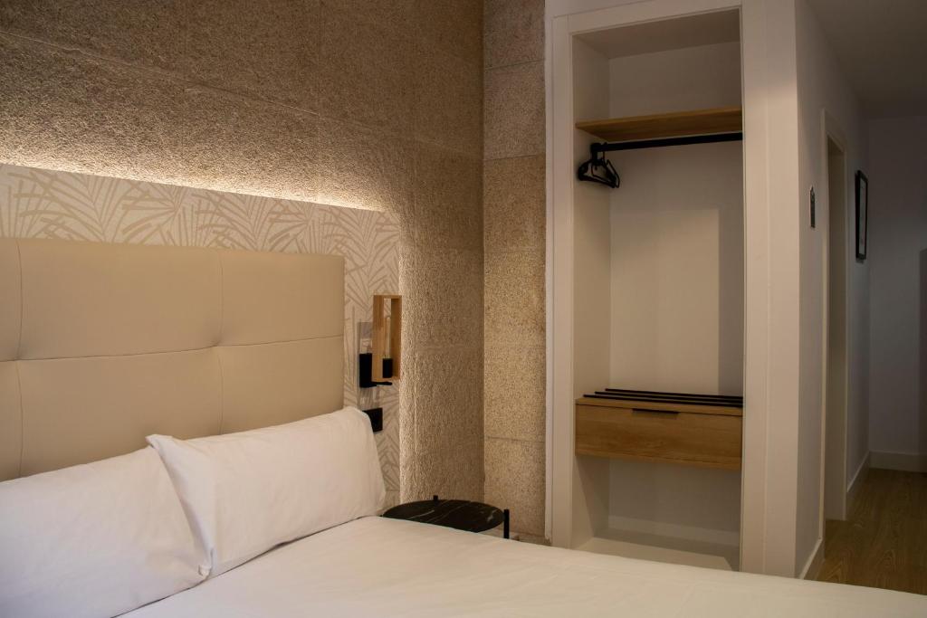 Postel nebo postele na pokoji v ubytování Hotel Alda Orzán