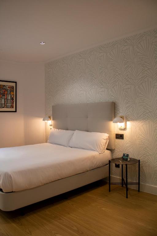 Postel nebo postele na pokoji v ubytování Hotel Alda Orzán