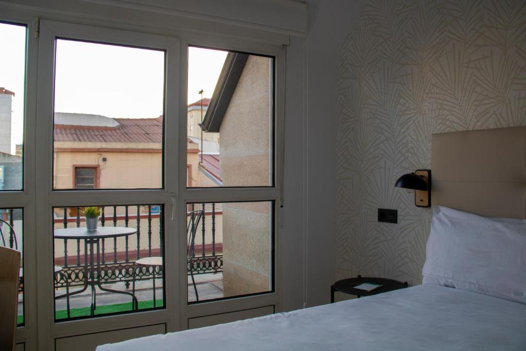 Postel nebo postele na pokoji v ubytování Hotel Alda Orzán