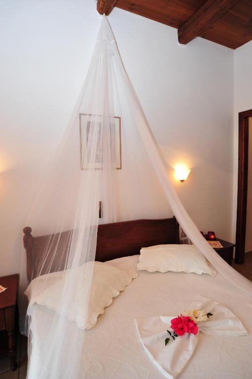Postel nebo postele na pokoji v ubytování Kavousi Resort