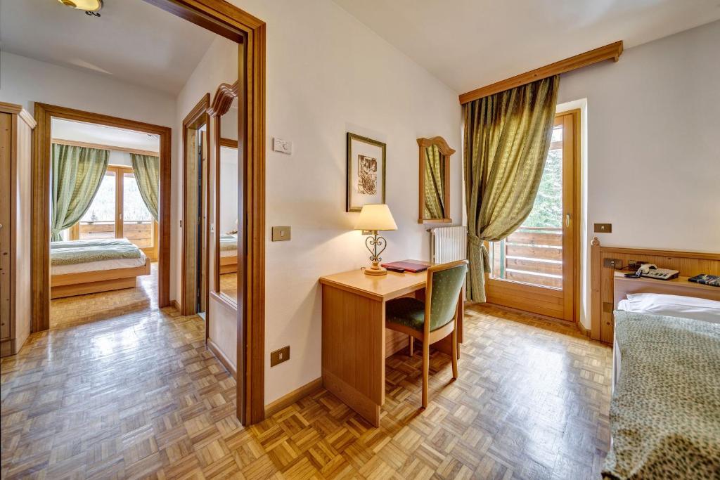 Кровать или кровати в номере Hotel Piccolo Pocol