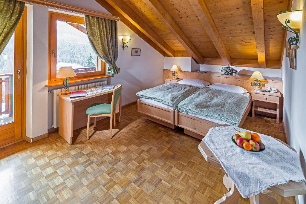 Кровать или кровати в номере Hotel Piccolo Pocol