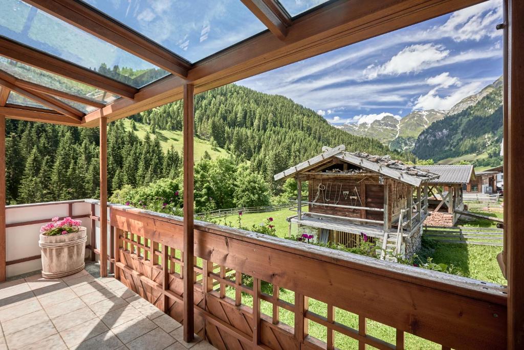 an empty porch with a view of a mountain at Blasigsuite Blasighof in Racines