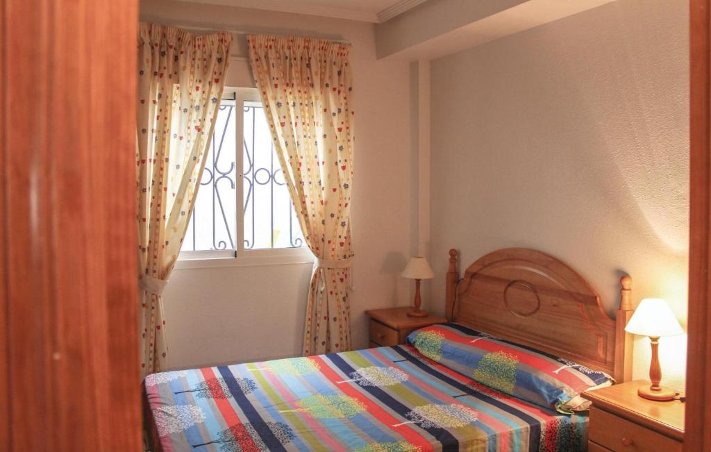 A bed or beds in a room at Amazing Apartment In Orihuela Costa