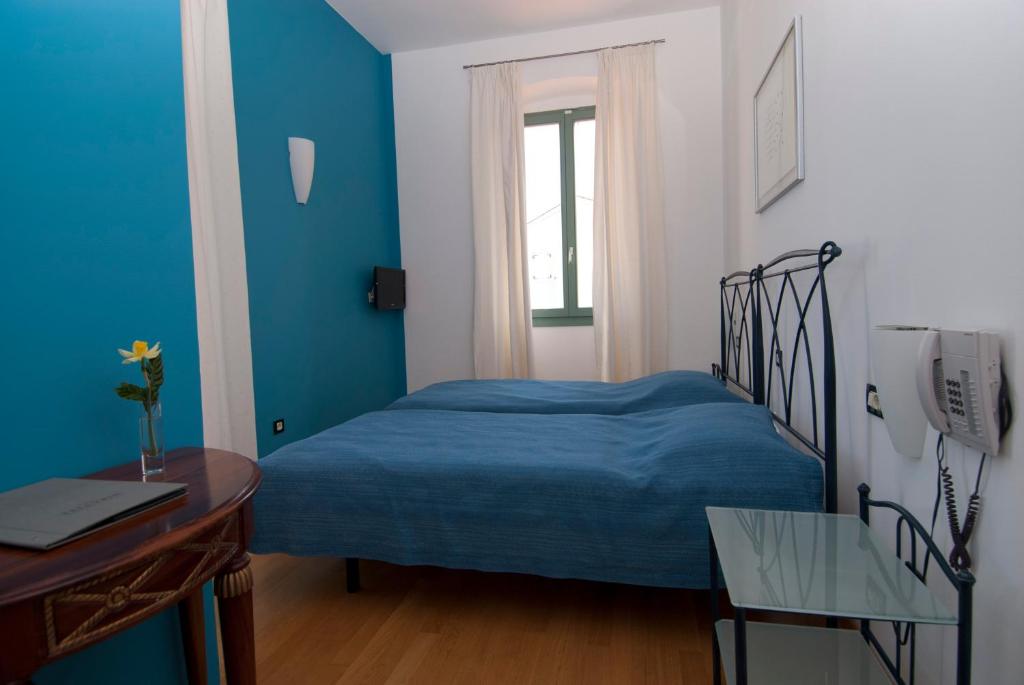 Postel nebo postele na pokoji v ubytování Hotel Televrin