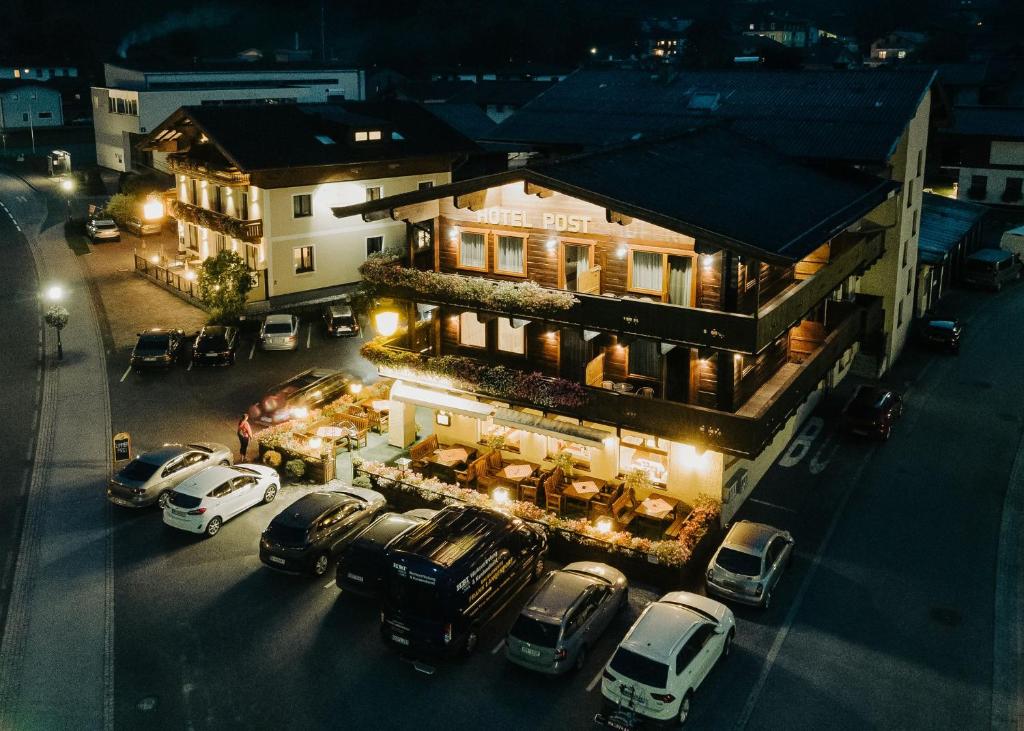 an aerial view of a house with cars parked in front at Hotel Post Fusch in Fusch an der Glocknerstraße