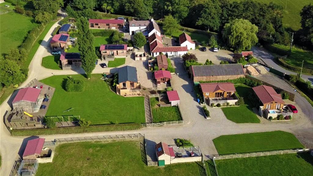 an aerial view of a house with a yard at Barker Stakes Farm in Pickering