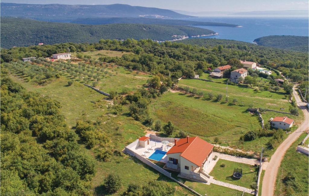 an aerial view of a house on a hill at Lovely Home In Krnica With House Sea View in Krnica