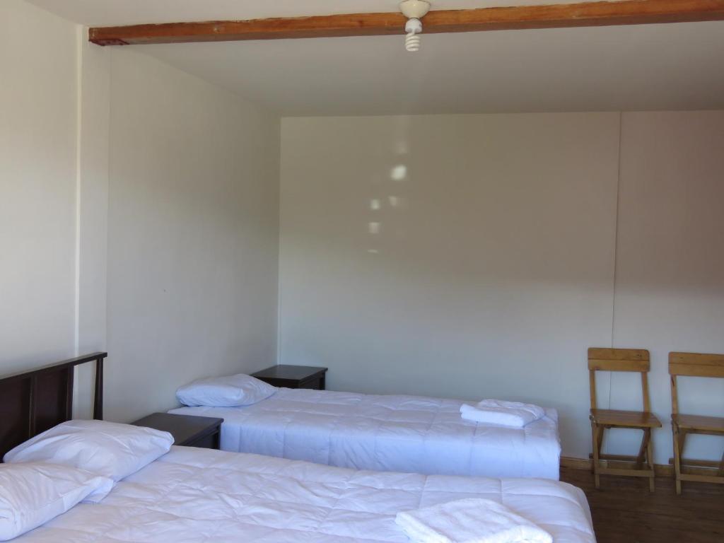 Postel nebo postele na pokoji v ubytování Schatzi Lodge