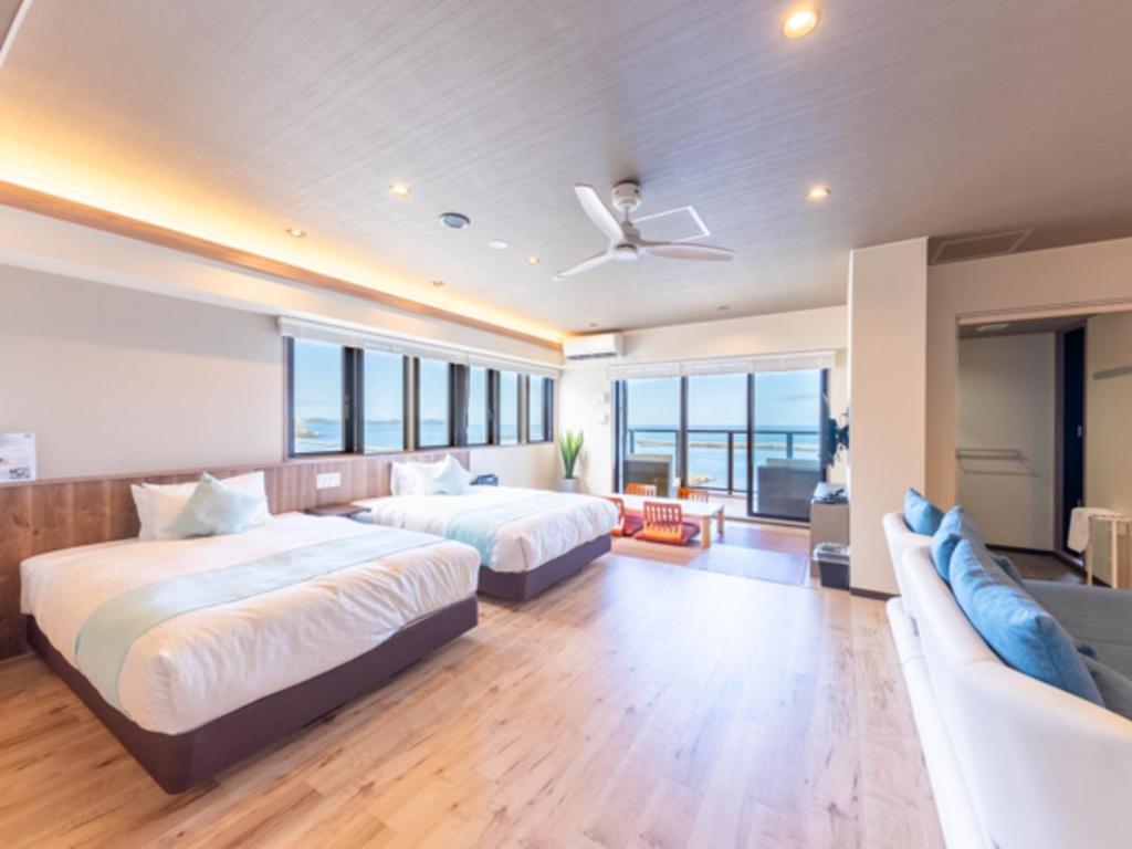 Postel nebo postele na pokoji v ubytování LiVEMAX RESORT Atami OCEAN