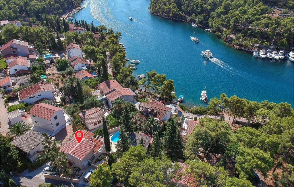 an aerial view of a river with houses and boats at Stunning Home In Vrboska With Kitchen in Vrboska