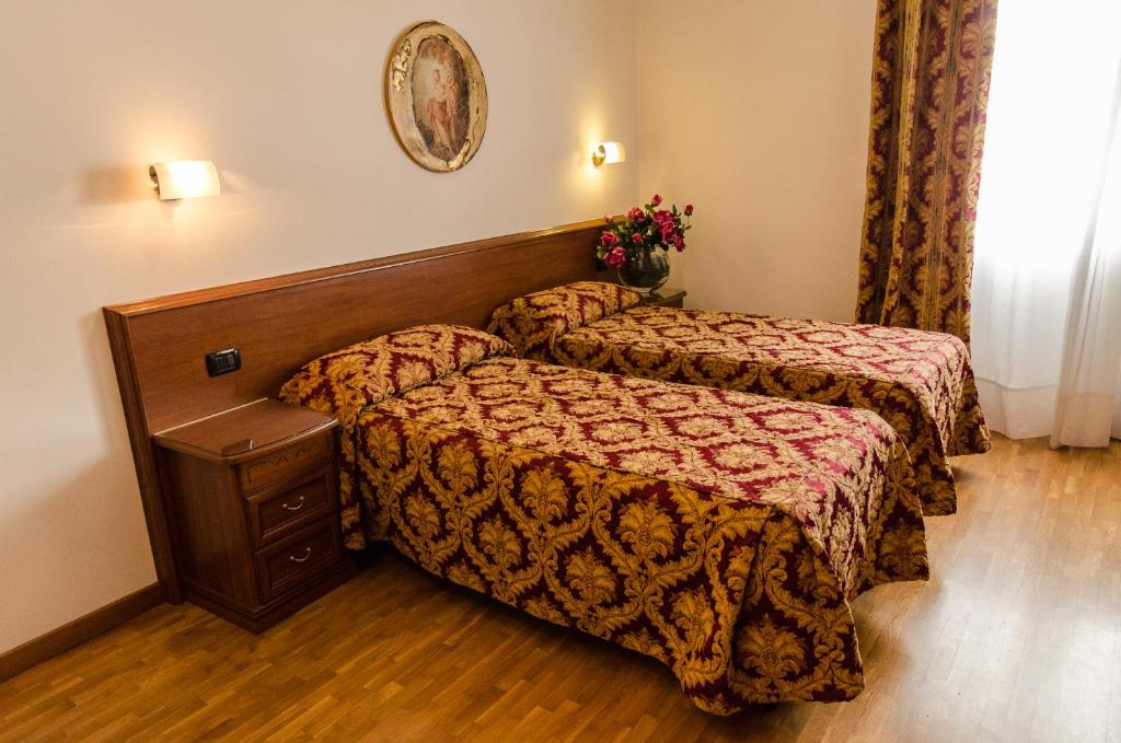 Łóżko lub łóżka w pokoju w obiekcie Hotel HDomus