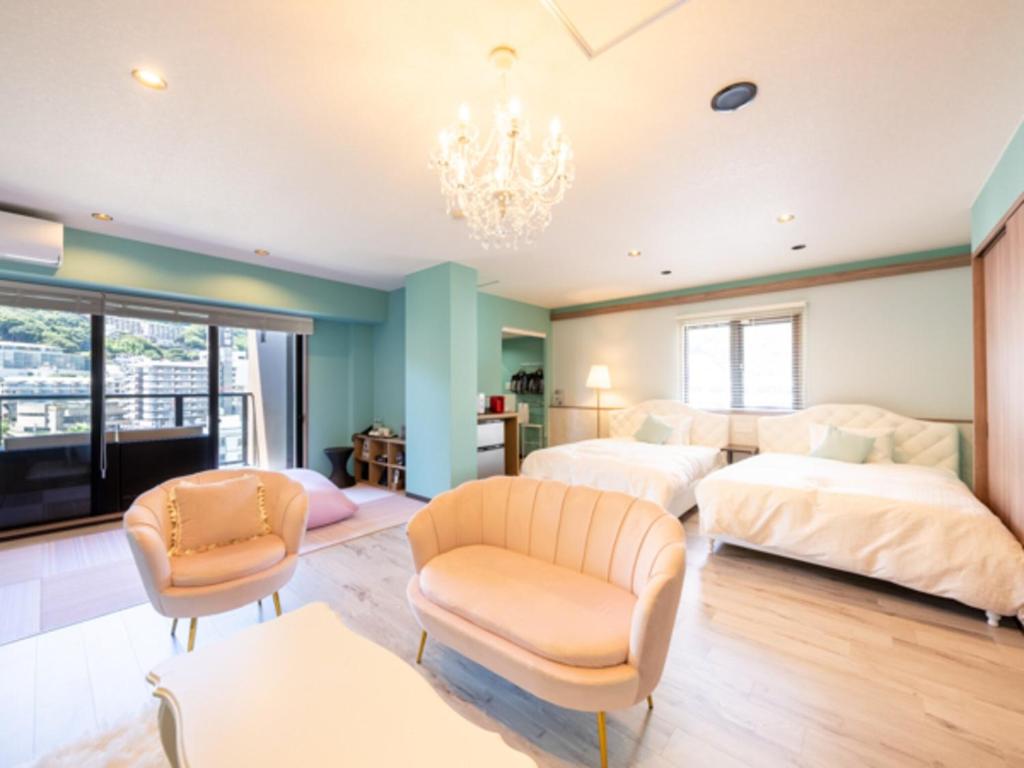 Postel nebo postele na pokoji v ubytování LiVEMAX RESORT Atami OCEAN