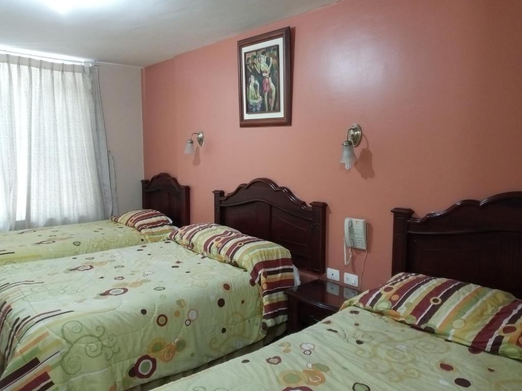 Postel nebo postele na pokoji v ubytování Hostal EL CALLEJÓN