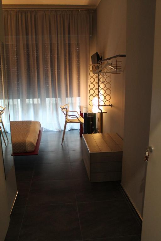 Postel nebo postele na pokoji v ubytování Alma Hotel