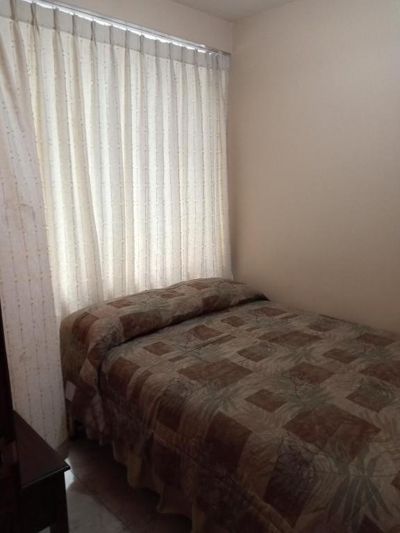 Postel nebo postele na pokoji v ubytování Hostal EL CALLEJÓN