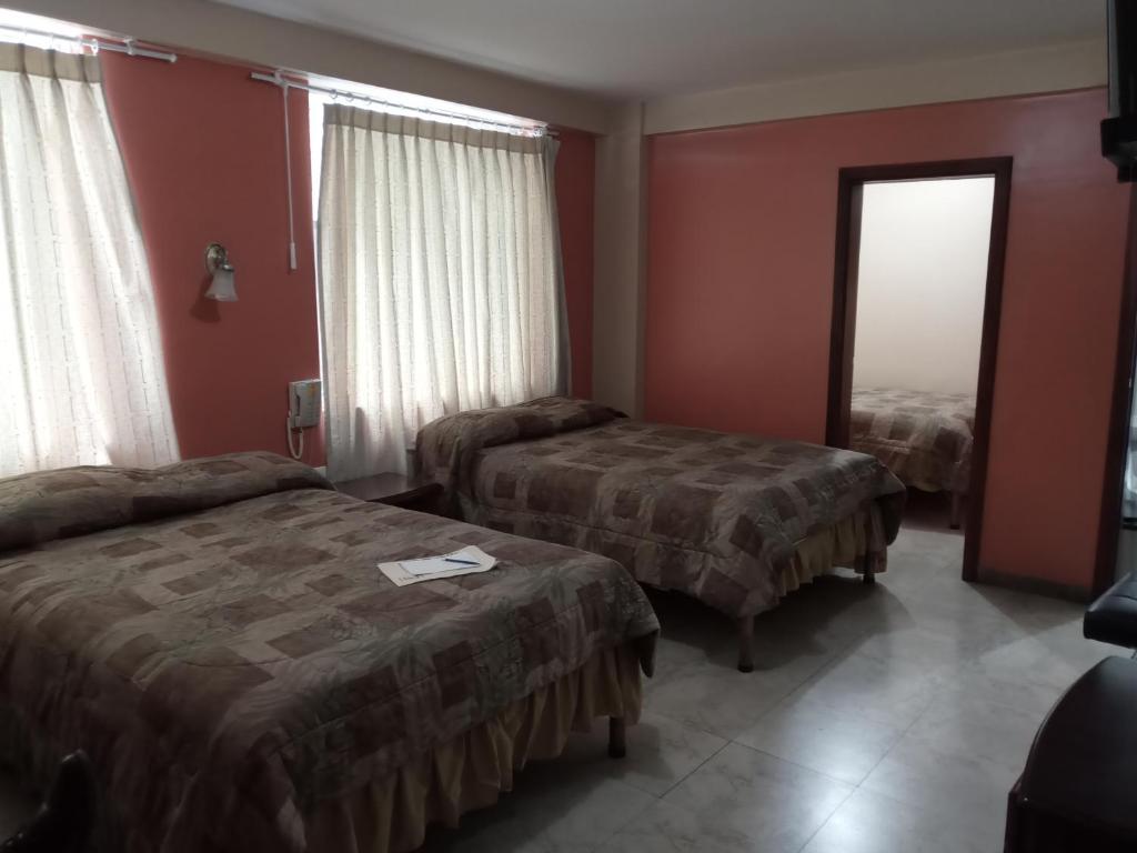 Postel nebo postele na pokoji v ubytování Hostal EL CALLEJÓN