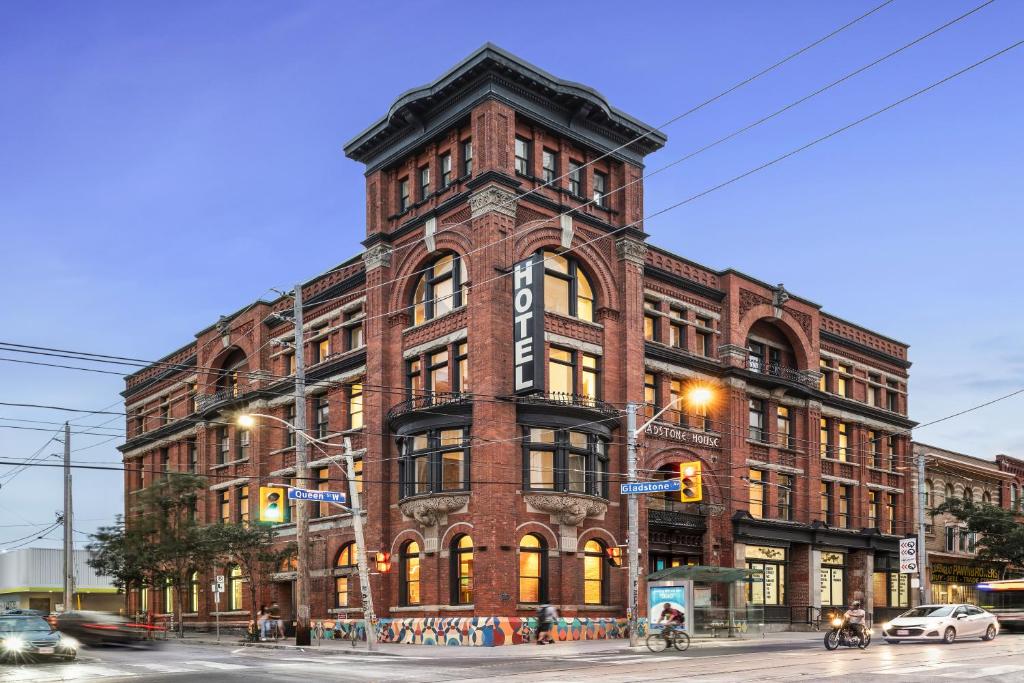 a large brick building on the corner of a street at Gladstone House in Toronto