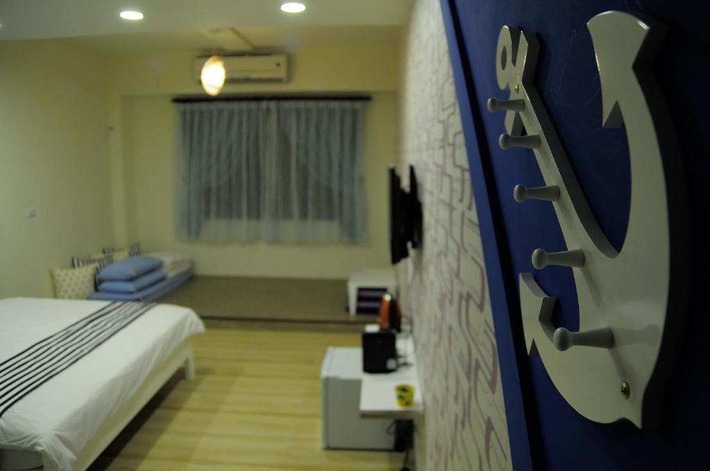 Postel nebo postele na pokoji v ubytování Meet ‧ Happiness B&B