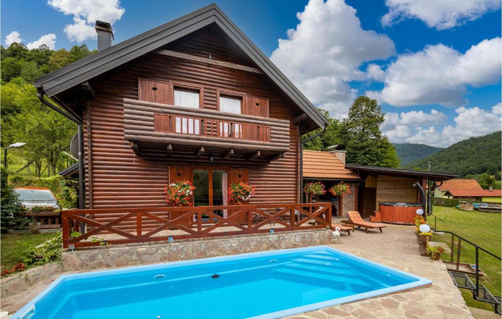The swimming pool at or close to Cozy Home In Blazevci With Sauna
