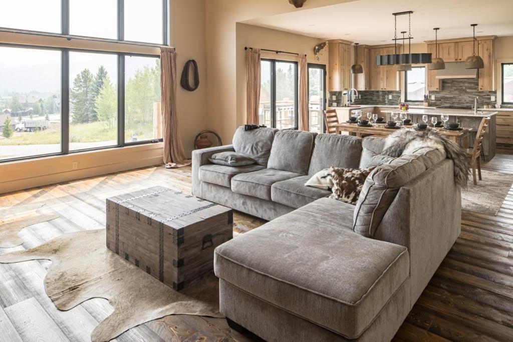 a living room with a couch and a table at Big Pine Chalet in Big Sky