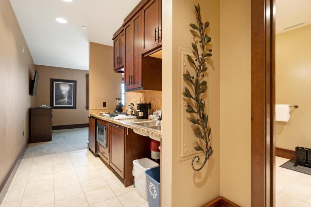 a kitchen with a sink and a counter top at Arrowleaf Lodge - 1 Bed Studio #111B in Park City