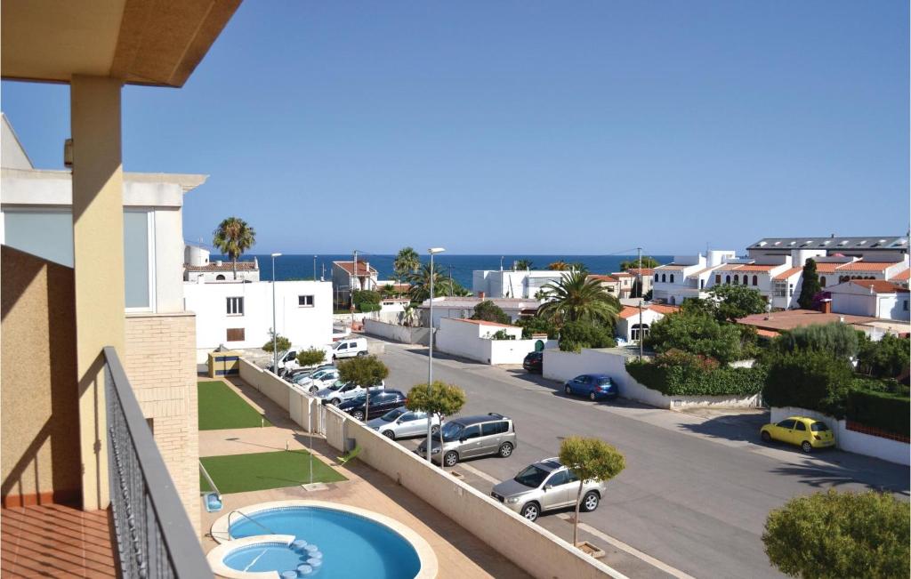 a view from a balcony of a city with a parking lot at 2 Bedroom Awesome Apartment In Vinaros in Vinarós