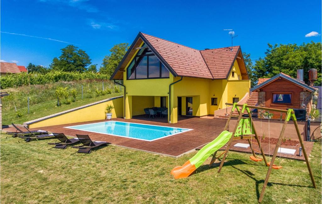 a house with a pool and a slide at Amazing Home In Selnica With Kitchen in Selnica