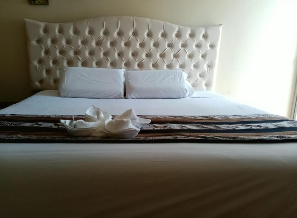 Postel nebo postele na pokoji v ubytování Hotel Mantas Cusco