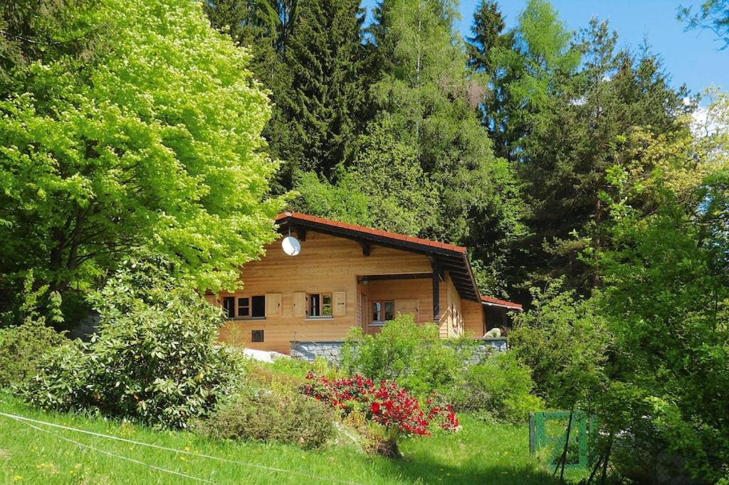 a wooden cabin in the middle of a forest at holiday home Schneider, Rinchnach in Rinchnach