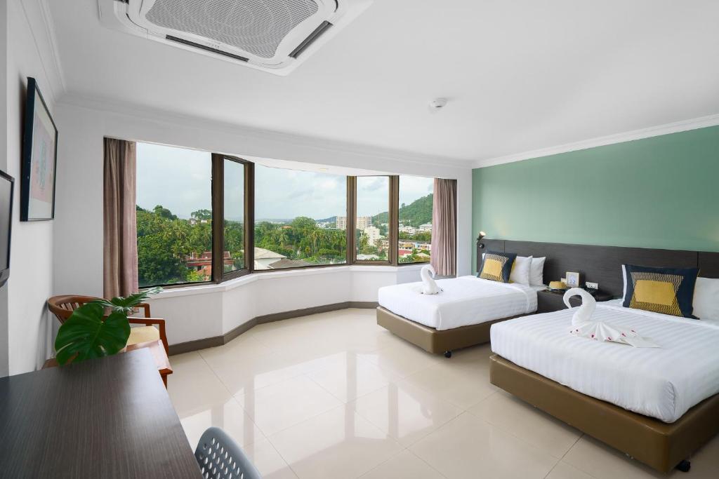 Postel nebo postele na pokoji v ubytování I Pavilion Hotel Phuket