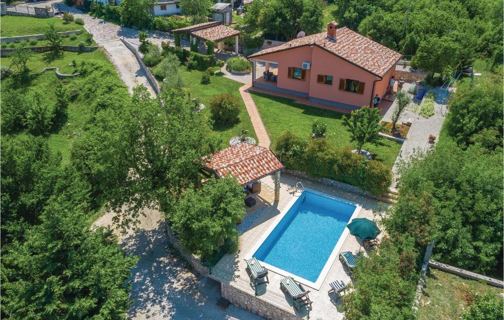 an aerial view of a house with a swimming pool at Gorgeous Home In Labin With Kitchen in Raša