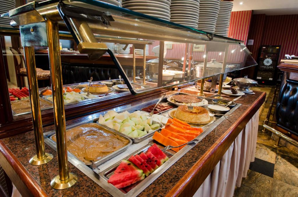 a buffet line with many different types of food at Rio Aeroporto Hotel Galeão in Rio de Janeiro