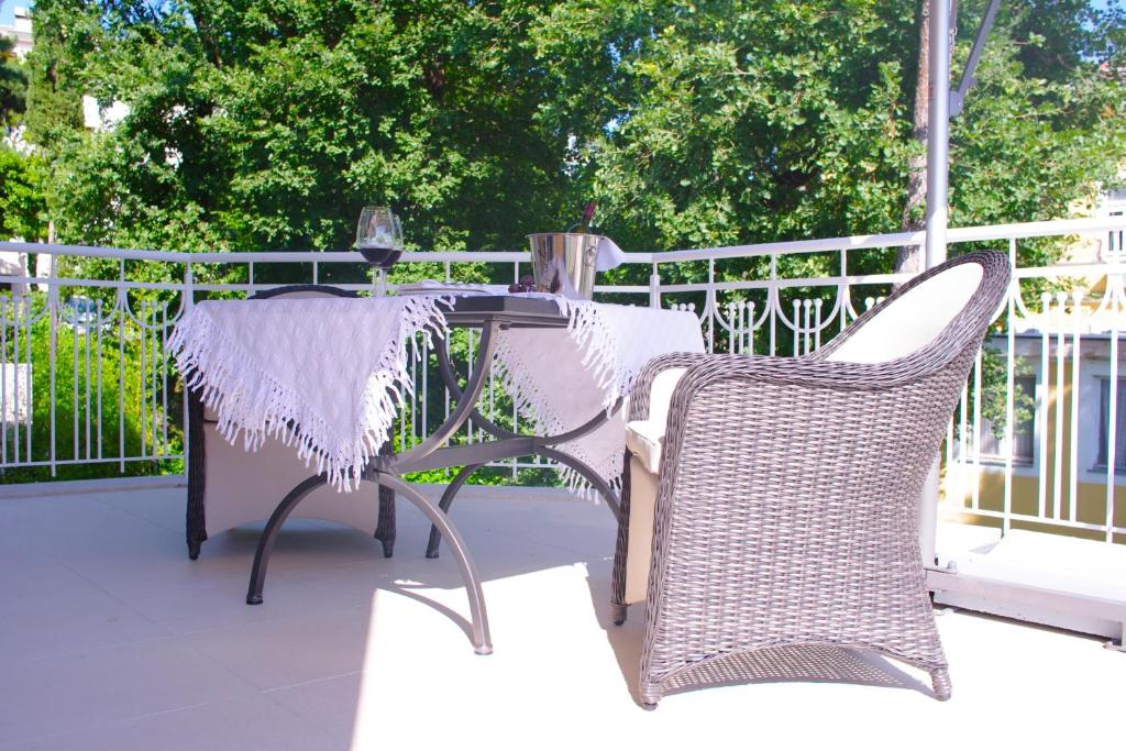 a table and two chairs on a patio at Guest House Villa Dagmar in Crikvenica