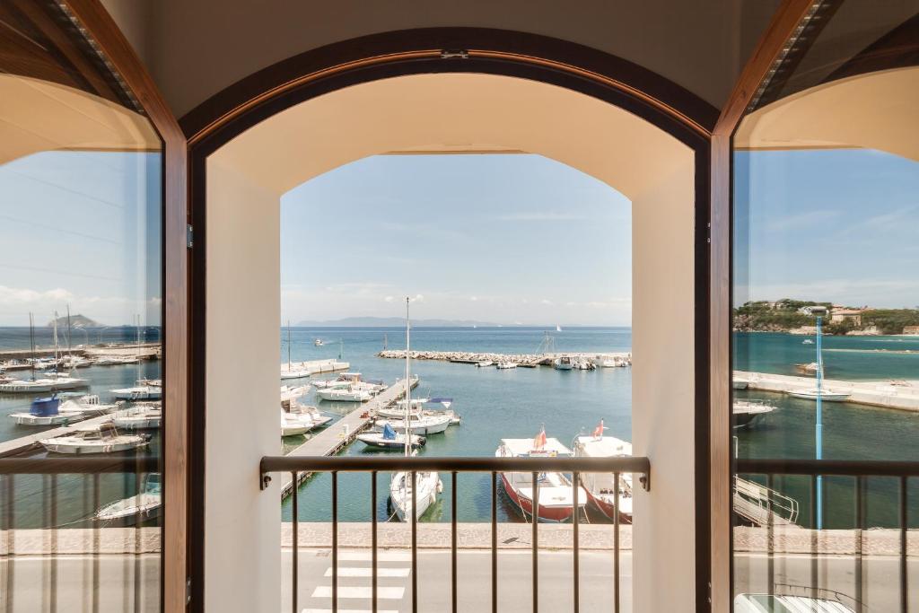 a view of a marina from a balcony at La Vecchia Scuola in Cavo