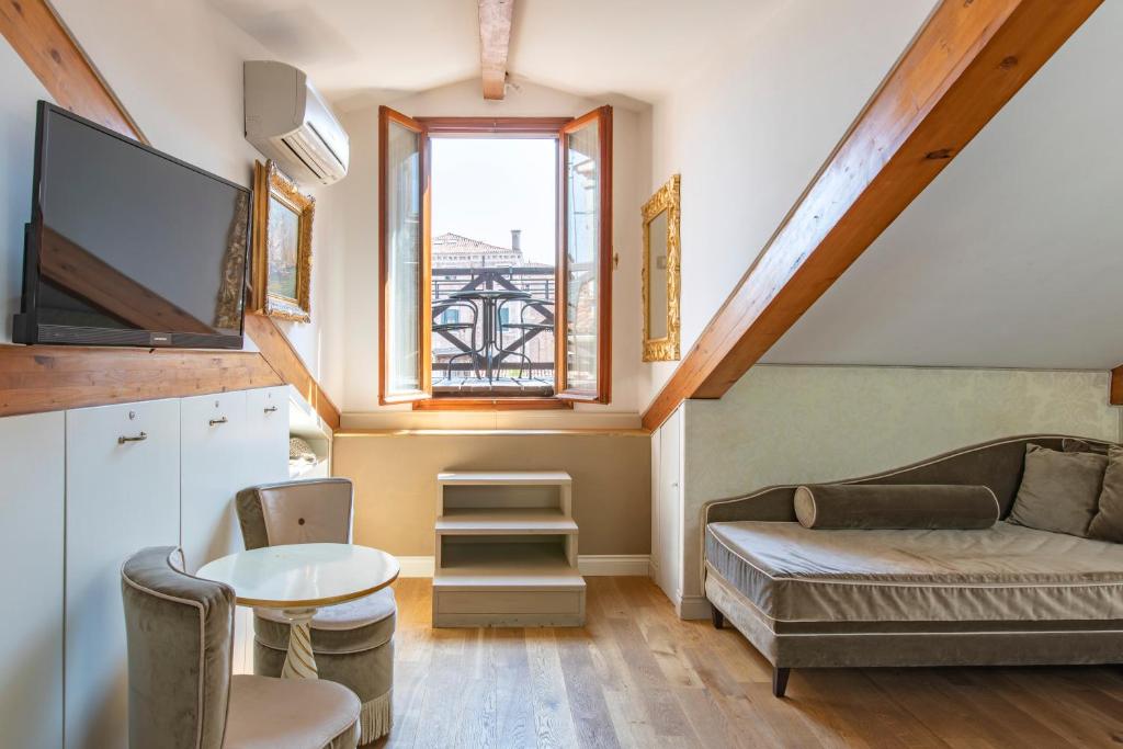 TV a/nebo společenská místnost v ubytování B&B Patatina