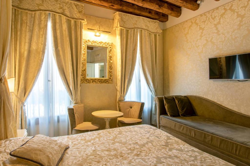 Postel nebo postele na pokoji v ubytování B&B Patatina
