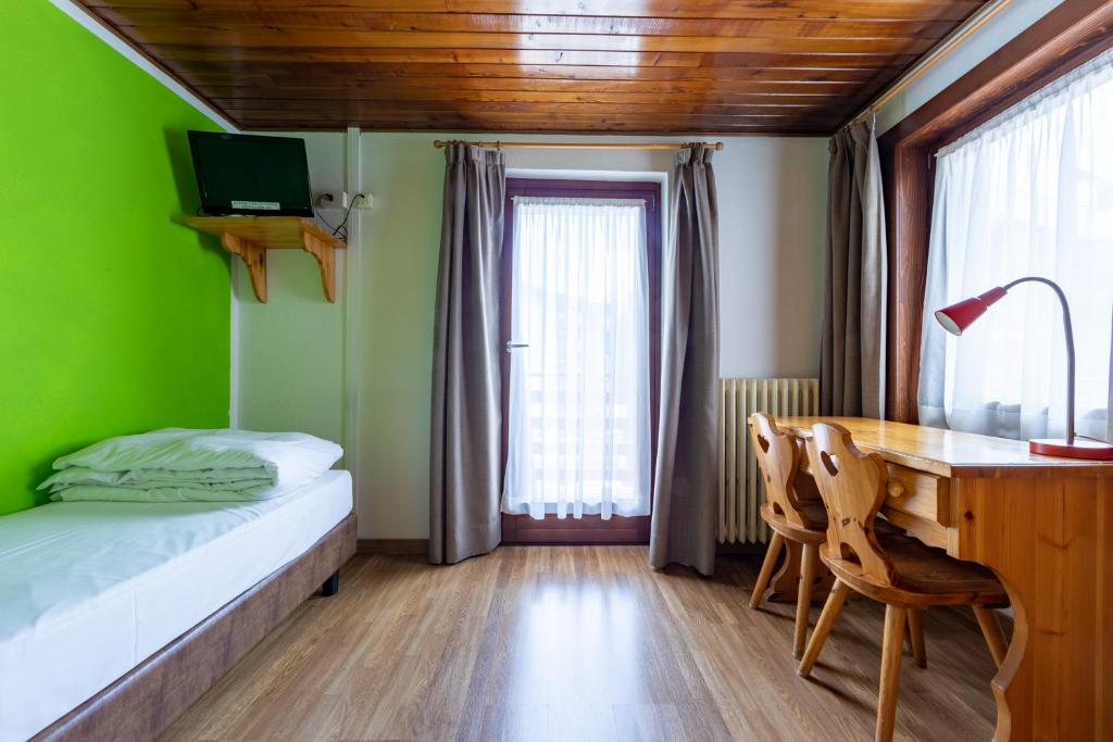 Postel nebo postele na pokoji v ubytování Hotel Meuble' Joli